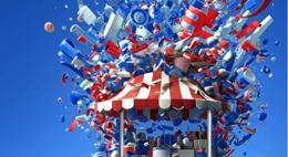 Installation artistique colorée avec objets en suspension éclatant au-dessus d’un stand rayé, évoquant créativité, fête et expérience immersive. Foire de Paris